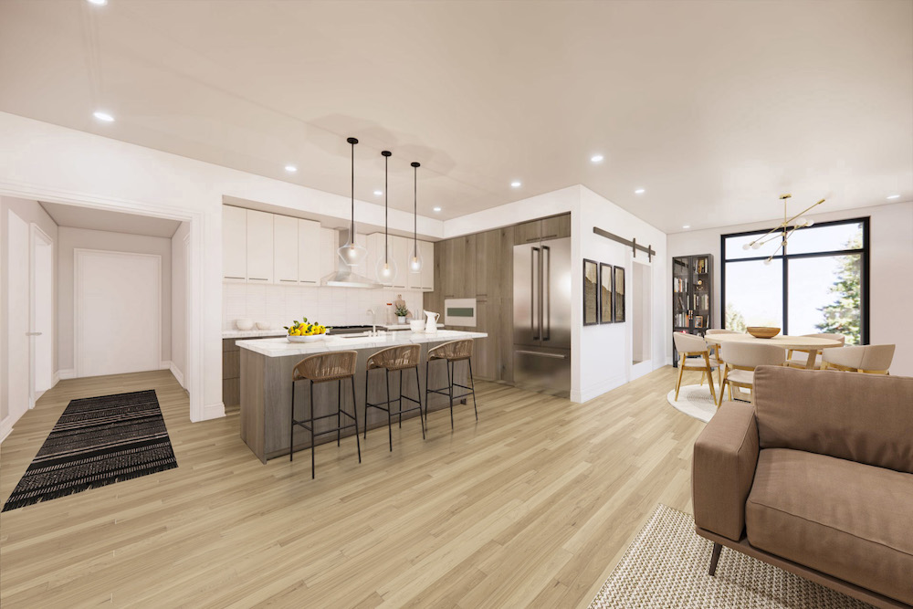 An open, gourmet kitchen within The Henry in Bozeman, featuring an island with bar seating.