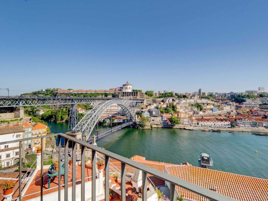 Bathed in natural light and overlooking the Douro River, this two-bedroom apartment resides in a lovingly restored building encircled by Porto’s most emblematic landmarks.