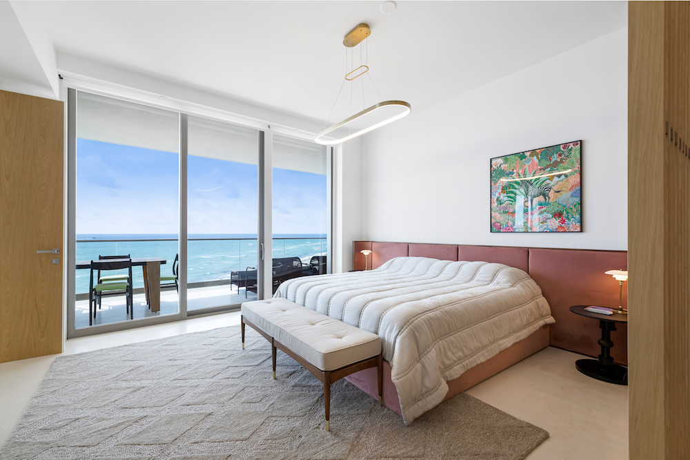 A breathtaking bedroom with ocean views in Armani Casa.