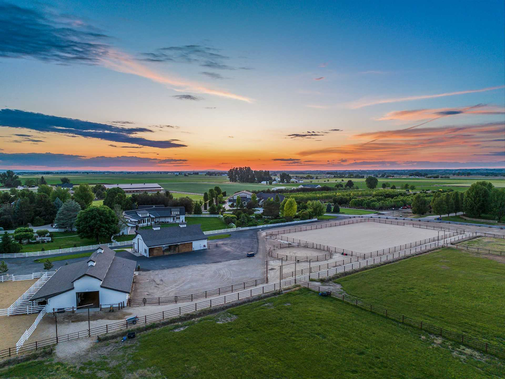  7351 W Ledgerwood Lane in Idaho is 15-acre equestrian retreat that offers three separate three-acre pastures, a six-stall barn, tack room, riding arena and RV storage. 