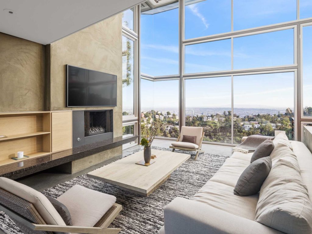 Fully furnished and available for long or short-term leases, this epic home presents breathtaking city and canyon views from walls of windows plus a variety of outdoor spaces—perfect for hosting.