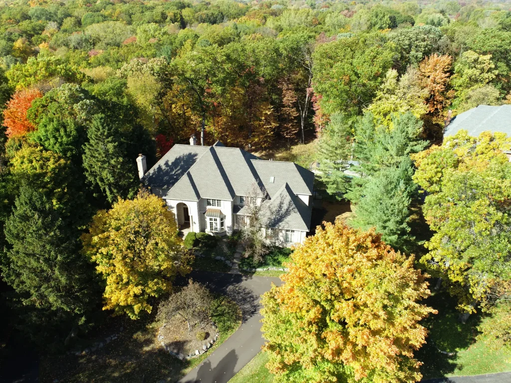 Moderately secluded on 1.36 acres, this estate resides in a leafy neighborhood court with mature woodlands that provide peace and privacy.